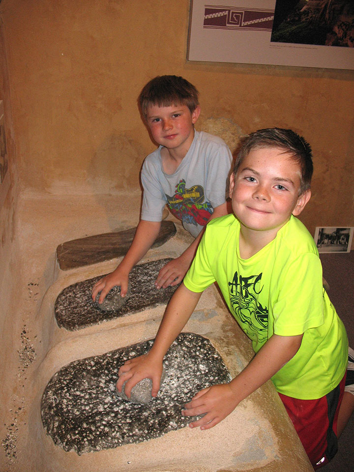 Grinding corn at the Maxwell Summer Camp