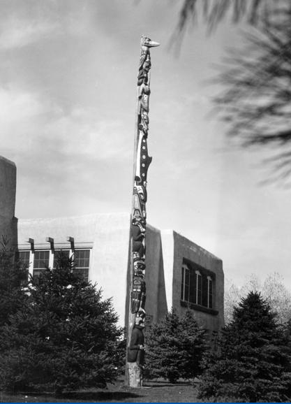 The Smith Family Totem Pole was initially displayed in the gardens at UNM Scholes Hall, ca. 1960
