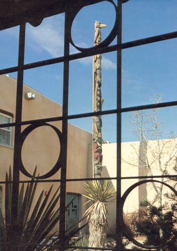 The Smith Family Totem Pole in the Maxwell Museum of Anthropology Courtyard, ca. 1970. Photo credit: The Maxwell Museum of Anthropology
