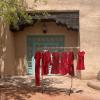 Red dresses hanging in the Maxwell Courtyard call attention to the thousands of missing and murdered Indigenous Women, Girls and 2-spirit individuals